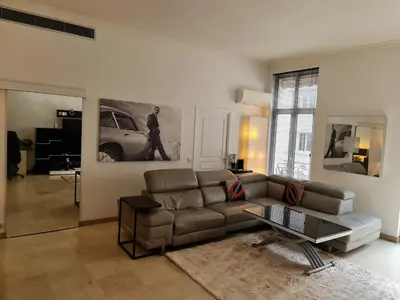 a kitchen with stainless steel cabinets and a light on the floor at Center palais in Cannes