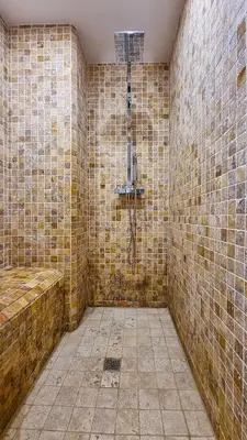 a bathroom with a shower in a brick wall at Villa 4 BR with pool, 5 minutes Cannes in Le Cannet
