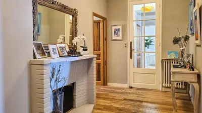 a living room with a fireplace and a mirror at Villa 4 BR with pool, 5 minutes Cannes in Le Cannet