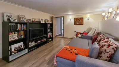 a living room with a couch and a tv at Villa 4 BR with pool, 5 minutes Cannes in Le Cannet