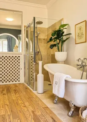 a bathroom with a tub and a potted plant at Villa 4 BR with pool, 5 minutes Cannes in Le Cannet