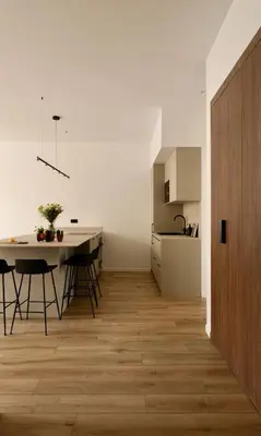 a kitchen and a dining room with a table and chairs at Somptueux avec grande terrasse in Cannes