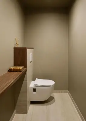 a bathroom with a white toilet in the corner at Somptueux avec grande terrasse in Cannes