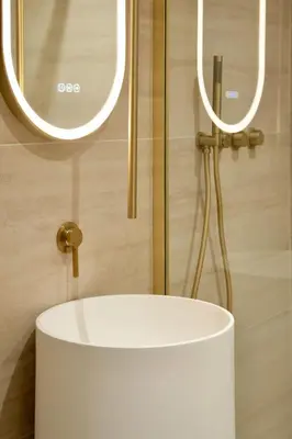 a bathroom with a white sink and a mirror at Somptueux avec grande terrasse in Cannes
