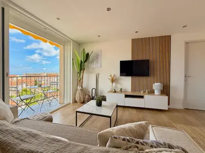 a living room with a couch and a tv at T3 Sea view walking distance of Palais, AC , Parking, Terrace in Cannes