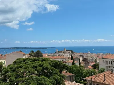 a view of a city with the ocean in the background at T3 Sea view walking distance of Palais, AC , Parking, Terrace in Cannes