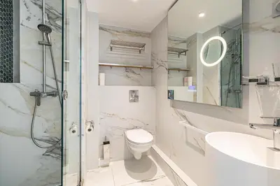 a bathroom with a shower and a toilet and a sink at Modern apartment - 3BR- 6P - Croisette Plage in Cannes