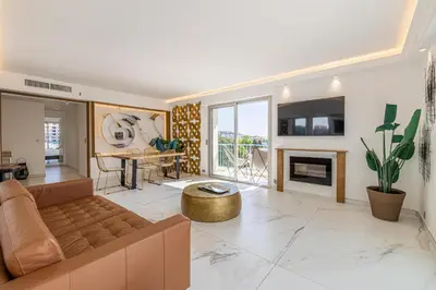 a living room with a couch and a fireplace at Modern apartment - 3BR- 6P - Croisette Plage in Cannes