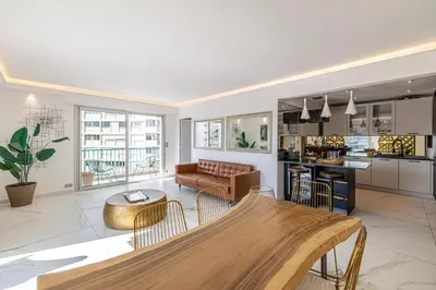 a living room with a couch and a table at Modern apartment - 3BR- 6P - Croisette Plage in Cannes