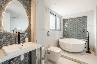 a bathroom with a tub and a sink and a toilet at Modern apartment - 3BR- 6P - Croisette Plage in Cannes