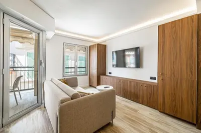 a living room with a couch and a tv at Charming flat - 2BR-6P - Cannes in Cannes