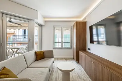 a living room with a couch and a tv at Charming flat - 2BR-6P - Cannes in Cannes