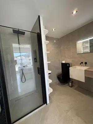 a bathroom with a shower and a sink at Cannes 2 suites 2 terrasses in Cannes