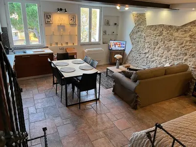 a living room with a couch and a table at CANNES SUQUET beautiful Duplex in Cannes