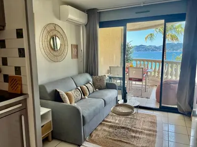 a living room with a couch and a view of the ocean at Palme d'Azur 409 in Cannes