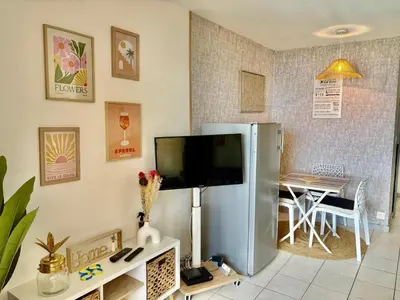 a living room with a refrigerator and a table at Palme d'Azur 409 in Cannes