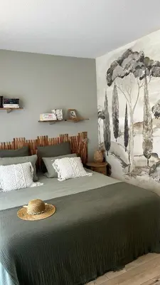 a bedroom with a bed with a hat on it at villa sur le toit au centre de Cannes in Cannes