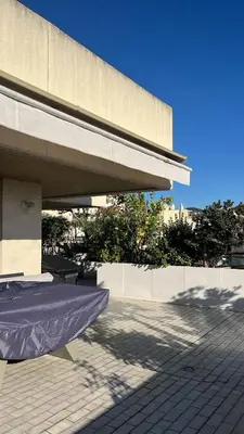 a building with a mattress on a patio at villa sur le toit au centre de Cannes in Cannes
