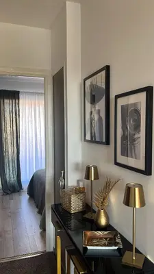a room with a desk and a bedroom with a bed at villa sur le toit au centre de Cannes in Cannes