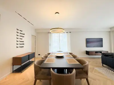 a dining room with a table and chairs at GRAY DUBOY D'ANGERS Luxury 3 bedrooms Croisette in Cannes