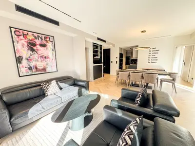 a living room with a couch and a table at GRAY DUBOY D'ANGERS Luxury 3 bedrooms Croisette in Cannes