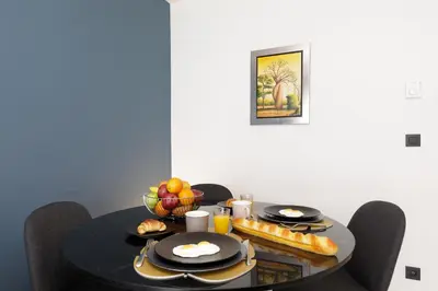 a black table with food on top of it at Gray d'Albion 3i7 YourHostHelper in Cannes