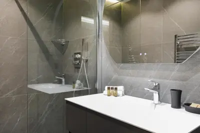 a bathroom with a sink and a shower at Gray d'Albion 3i7 YourHostHelper in Cannes