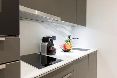 a kitchen with a coffee maker and a pineapple on the counter at Gray d'Albion 3i7 YourHostHelper in Cannes