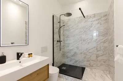 a bathroom with a shower and a toilet and a sink at Modern 3 bedroom apartment ideally located in Cannes