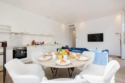 a living room with a table with food on it at Modern 3 bedroom apartment ideally located in Cannes