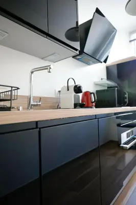 a kitchen with a counter top with a sink at 2 Pieces bourgeois centre de Cannes 4 couchages une pépite in Cannes