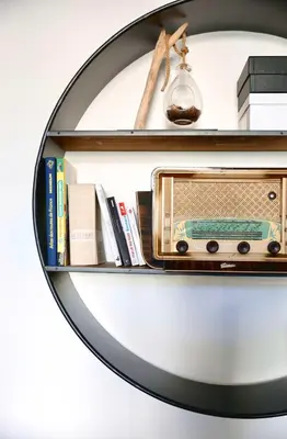 a mirror on a shelf with a radio at 2 Pieces bourgeois centre de Cannes 4 couchages une pépite in Cannes