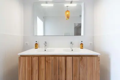 a bathroom with a sink and a mirror at Cannes Suquet Sea View & Beach Access in Cannes