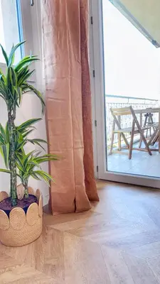 a room with a potted plant on a wooden floor at Mont Joli in Le Cannet