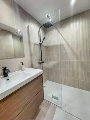 a bathroom with a sink and a shower at Mont Joli in Le Cannet