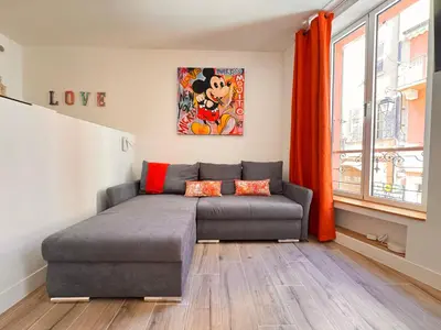 a bedroom with a bed and a painting on the wall at Casa Bisou Cannes - BOHEME in Cannes