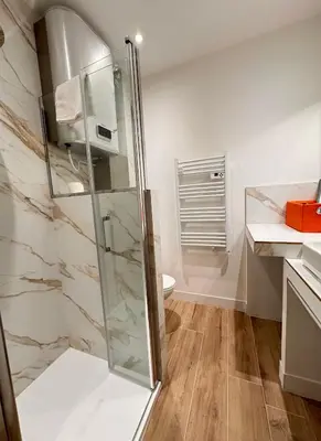 a bathroom with a glass shower with a toilet at Casa Bisou Cannes - BOHEME in Cannes