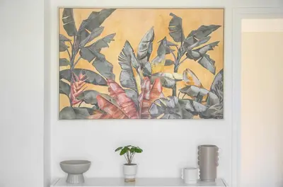 a painting hanging on a wall above a table at Elégant studio TERRASSE- proche PLAGES et CROISETTE A0B206 in Cannes
