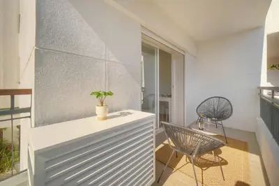 a room with a white cabinet and a chair at Elégant studio TERRASSE- proche PLAGES et CROISETTE A0B206 in Cannes