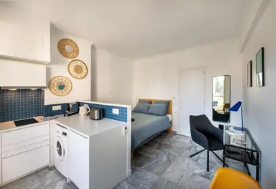 a blue door in a bathroom with a sink at L'Astrolabe - Studio - refurbished - seaside in Cannes