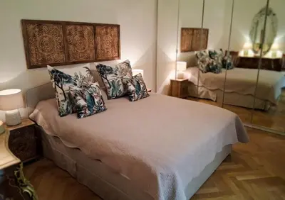 a bedroom with a bed with pillows on it at La Californie Views II in Cannes