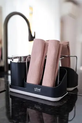 a ironing board with two pairs of socks on it at Apartment in Cannes in Cannes
