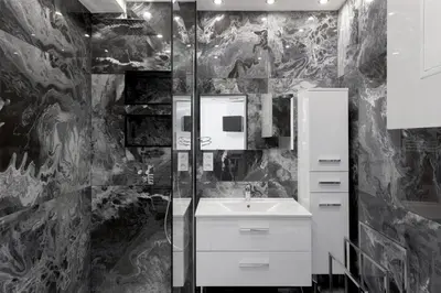a black and white bathroom with a sink and a shower at Croisette Star - Bd Croisette in Cannes