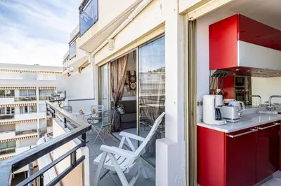 a balcony with a kitchen on a building at Latour Maubourg 20 by Halldis in Cannes