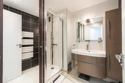 a bathroom with a shower and a sink at Latour Maubourg 20 by Halldis in Cannes