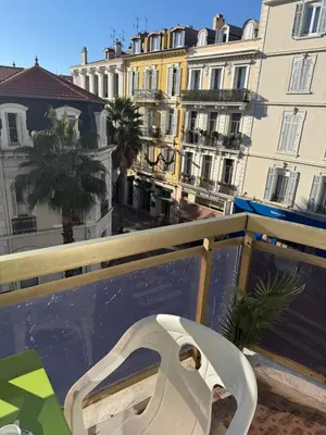 a white toilet on top of a wall with buildings at Central location, terrace, 2 bedrooms in Cannes