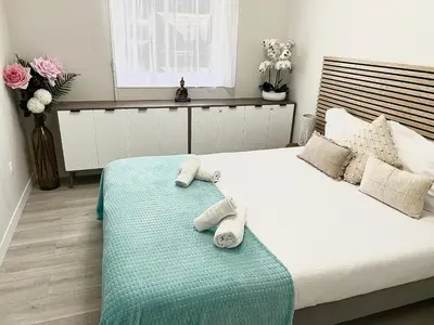 a bedroom with a bed with towels on it at Paradis in Cannes