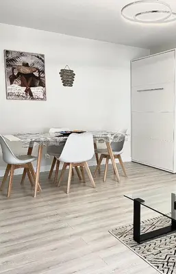 a living room with a couch and a table at Paradis in Cannes