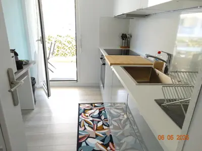 a kitchen with a sink and a counter top at Paradis in Cannes