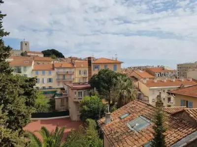 a group of buildings in a city with roofs at Centre Cannes Suquet in Cannes